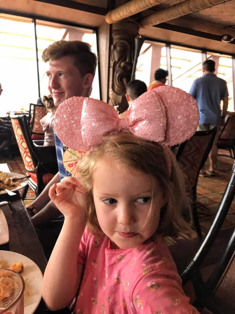 little girl in pink minnie ears at ohana