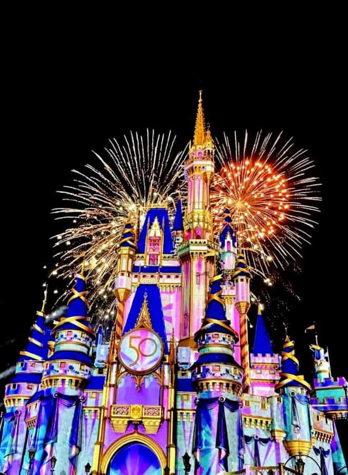 disney packing list for 2022 and beyond. Castle with fireworks at night. 