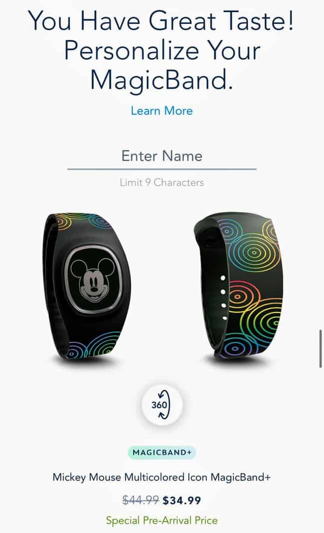 Magicband Plus Guide: mickey mouse magicband plus. Black wrist band with rainbow swirls and a Mickey Mouse head as decoration.