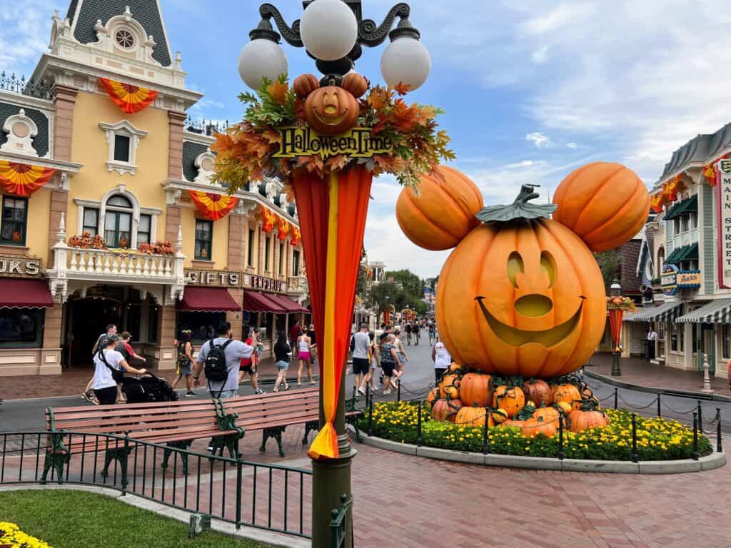 is disneyland busy in october? best days to visit in 2022. mickey pumpkin on Main Street. 