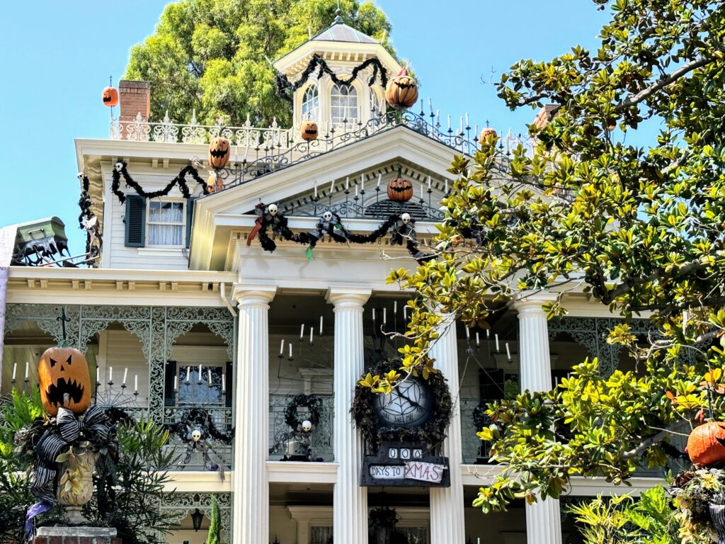 Is the haunted mansion holiday too scary for kids?  exterior shot of the mansion with christmas and halloween decorations.
